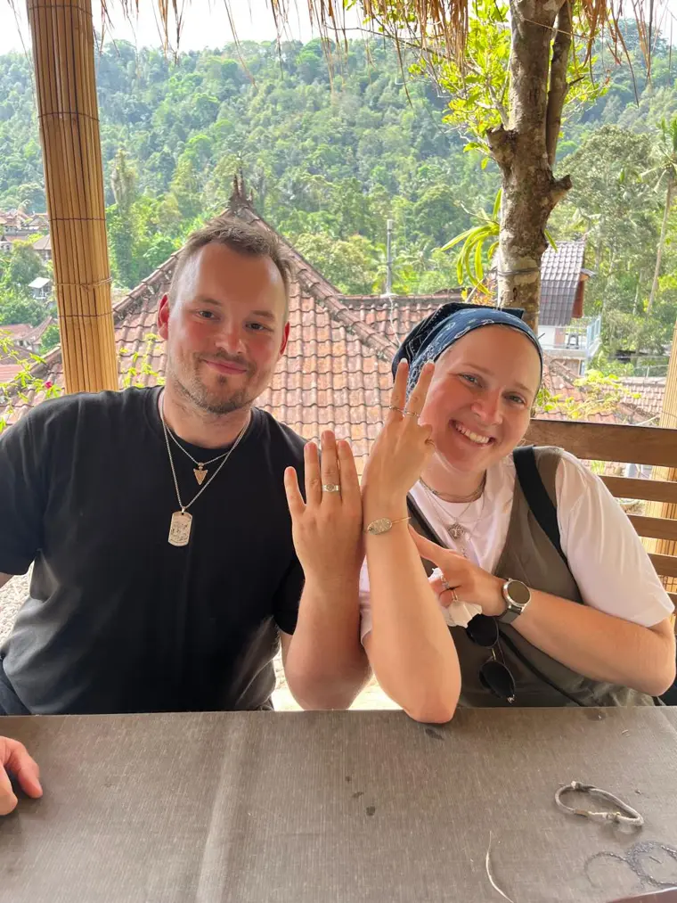 Couple showing their handmade silver rings